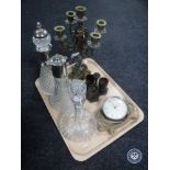 A tray containing brass five sconce candelabrum, two decanters with stoppers,