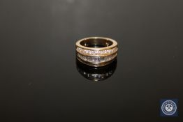 A 14ct gold ring set with baguette and round cut stones, size L.