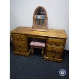 A pine six drawer knee hole dressing table with mirror and stool