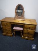 A pine six drawer knee hole dressing table with mirror and stool