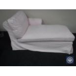 A contemporary chaise longue in pink loose cover