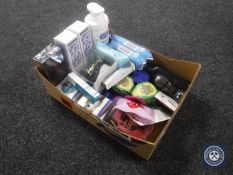 A box of assorted beauty products and cosmetics