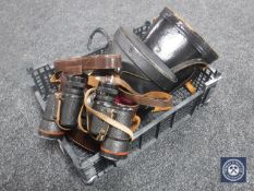 Three pairs of leather cased binoculars including Swift,