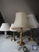 Four assorted brass table lamps and an onyx table lamp