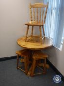 A circular pine pedestal kitchen table,