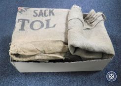 A box of eight Hessian coffee sacks,