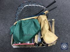 A box of books relating to fishing, two fishing bags, rod bag,