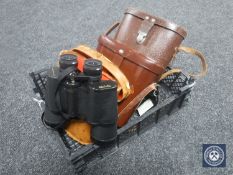 A basket of three pairs of leather cased binoculars; Carl Zeiss Jena,