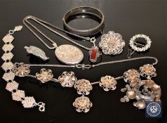 A collection of silver jewellery including locket, ring, bangle,