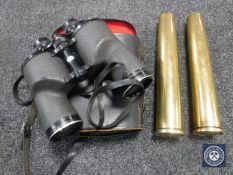 Two brass ammunition shells and a set of cased Turners binoculars