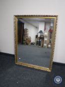 A gilt framed bevelled edge overmantel mirror