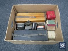 A box of antique glass lantern slides CONDITION REPORT: These include a range of