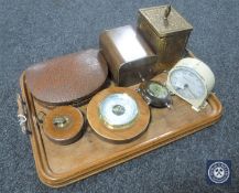An oak twin-handled serving tray containing walnut and brass tea caddies, cased manicure set,