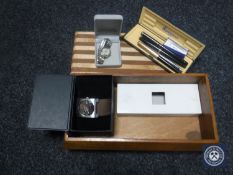 A wooden trinket box containing Waterman and Parker fountain pens/ball-point pen,