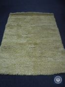 A hand tufted shaggy yellow white mix rug, 160 cm x 230 cm, rrp £513.