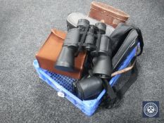 A basket of three sets of binoculars - Super Zenith, Liebernen Gortz etc,