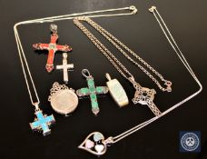 A collection of silver jewellery including several crucifixes