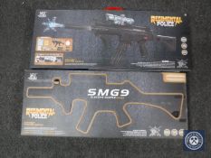 Two boxed Regimental Police water pellet SMG9 guns