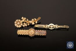 Three 15ct gold brooches, two set with pearls, 8.