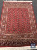 A Bokhara carpet on red ground,