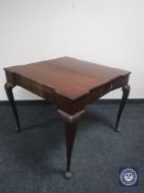 A Victorian turnover top tea table