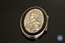 A white metal and tortoiseshell pill box with a relief portrait of Queen Anne