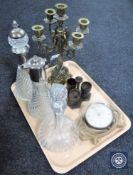 A tray containing brass five sconce candelabrum, two decanters with stoppers,