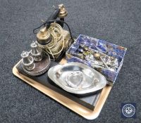 A tray containing retro style telephone, wine coaster, cruet set,