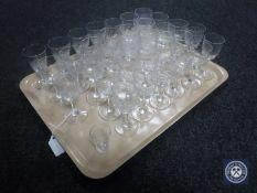 A tray of early 20th century and later drinking glasses