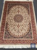 A Keshan carpet on beige ground,