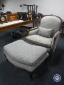 A Medallion French style oversized armchair with footstool
