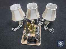 A tray of brass candle holder and candle sticks, metal tankard, pewter otter figure,