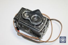 A Rolleiflex with Tessar 75mm lens.