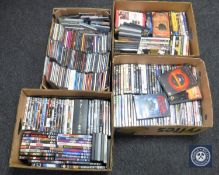 Four boxes of assorted CD's and DVD's