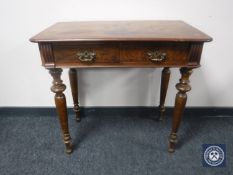 A Victorian walnut writing table fitted two drawers CONDITION REPORT: One leg loose