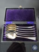 A set of six cased silver teaspoons