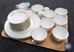 A tray containing twenty-three pieces of Royal Worcester white and gilt tea and dinner ware