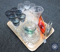 A tray containing metal swan ornament, assorted glass ware including wine glasses,