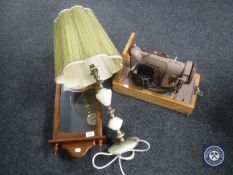 A cased vintage Singer sewing machine, pair of boxed hurricane lamps,