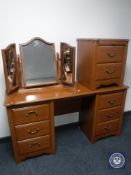 A contemporary kneehole dressing table with mirror,