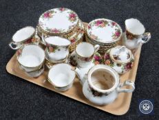 A tray containing thirty-two pieces of Royal Albert Old Country Roses tea china