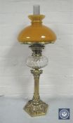 A good Victorian brass King & Brown oil lamp with glass chimney and tan shade,