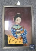 A Chinese reverse painting on glass depicting a lady with a dog
