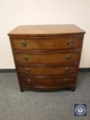 A mahogany bow fronted chest of drawers, width 76 cm.