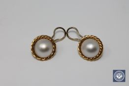 A pair of 18ct gold mabe pearl earrings