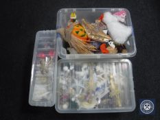 Three plastic storage crates containing soft toys,