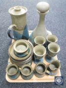 A tray containing a studio pottery coffee set together with matching pottery decanter and four