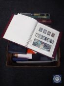 Two boxes of assorted stamps and stamp albums - World Cup, first day covers, locomotive,