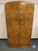 An early twentieth century figured walnut Gentleman's wardrobe, width 84 cm.