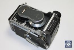A Mamiya C3 with 80mm Sekor lens.